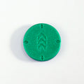 Green round object with a cascading chevron design on a white background