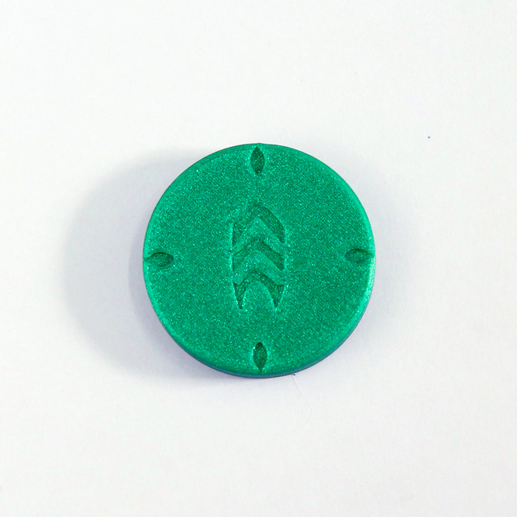 Green round object with a cascading chevron design on a white background